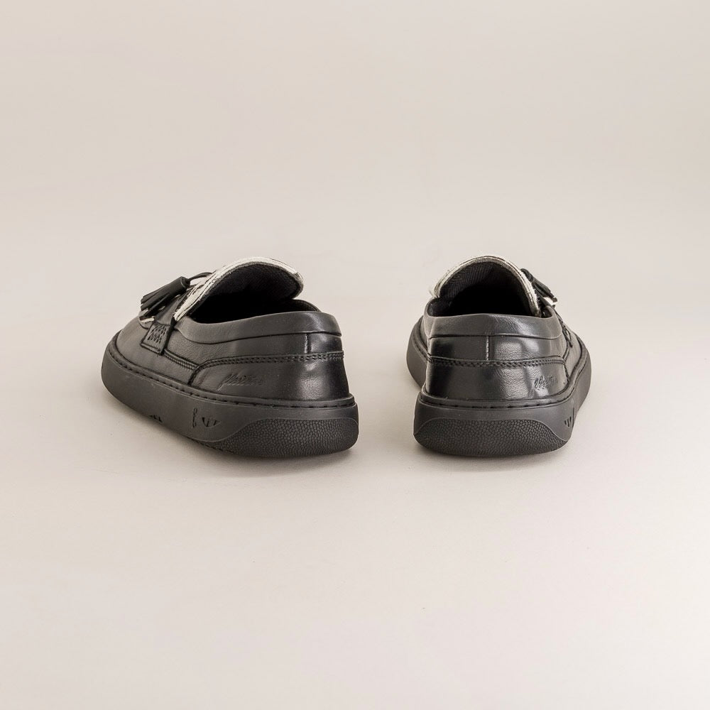 Pair of black barefoot shoes on a light gray background