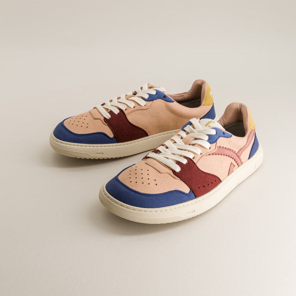 Colorful barefoot sneakers on a light gray background