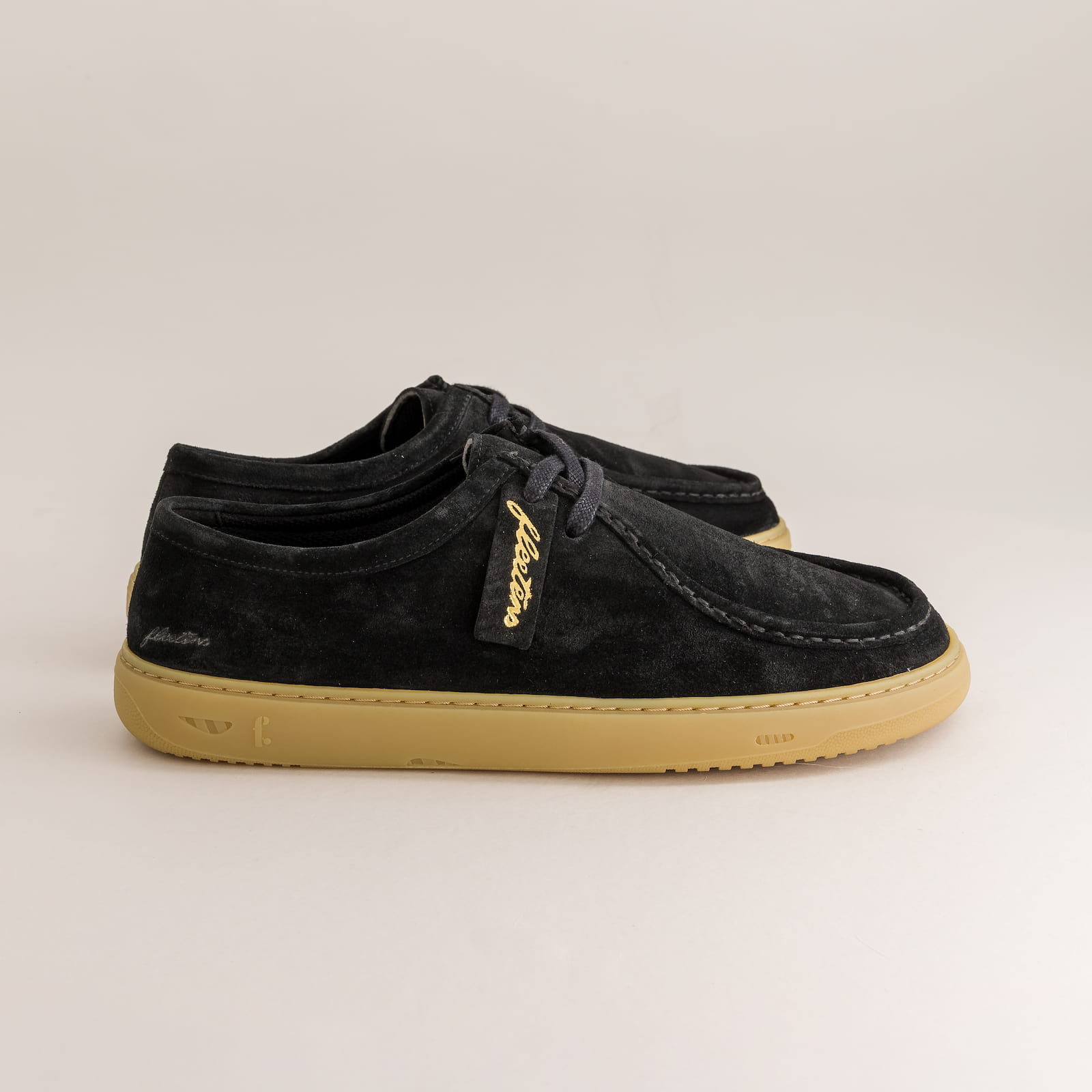Black barefoot derby shoes on a side view