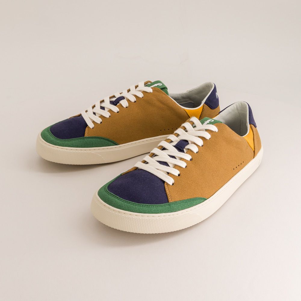 Pair of multicolored barefoot sneakers on a light gray background