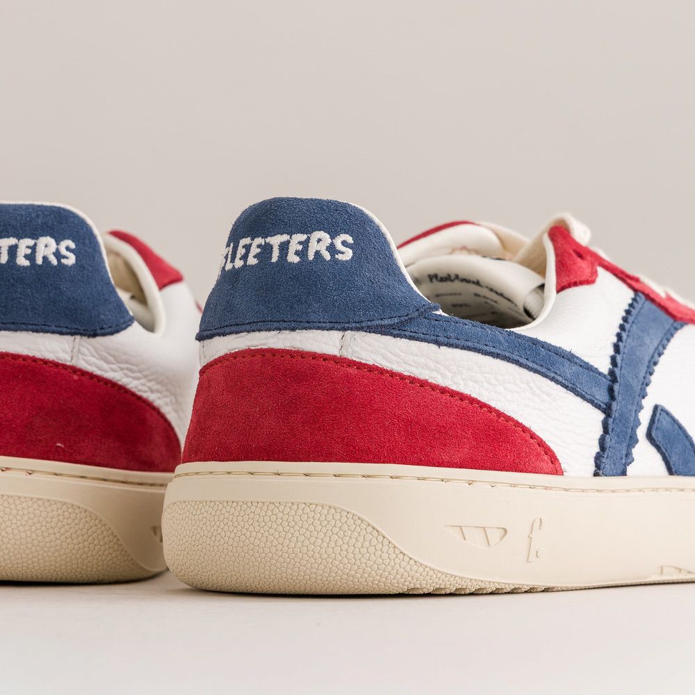Red, white, and blue sneakers with 'Fleeters' branding on a light gray background