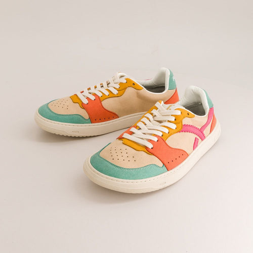 Colorful barefoot sneakers with a heart design on a light gray background