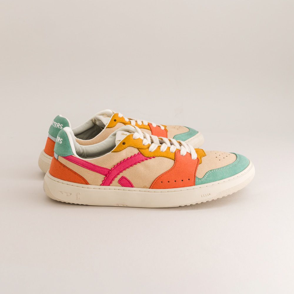 Colorful barefoot sneakers on a light gray background
