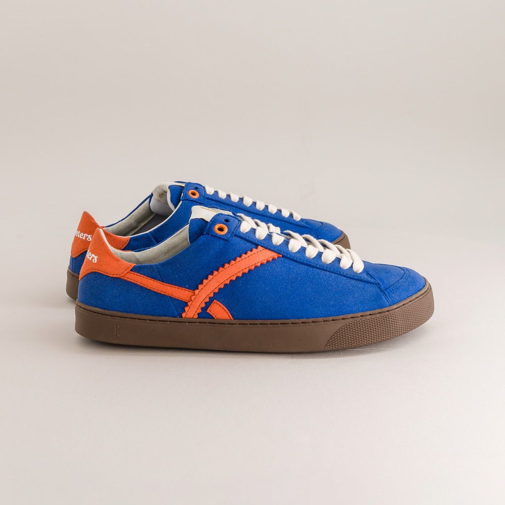 Blue and orange barefoot sneakers on a light gray background