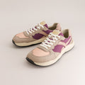 A pair of retro-style low-top barefoot sneakers in beige suede and light pink leather with purple side panels and white laces, photographed on a clean light gray studio background.