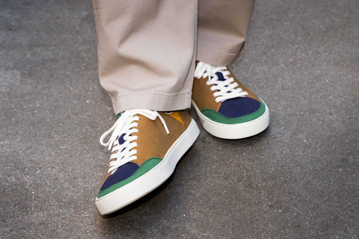Multicolor barefoot sneakers, on a concrete background