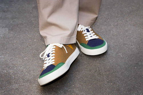 Multicolor barefoot sneakers, on a concrete background